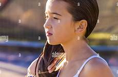 wet young girl beach hair brushing her after alamy melbourne australia stock swimming st kilda high