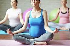 yoga pregnant women doing pregnancy stock asanas group padmasana dissolve trikonasana pressmaster d187