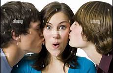 kissing two boys girl cheeks girls teen alamy teenage young high stock