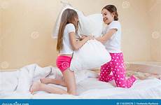 girls fighting two pillows laughing active while preview