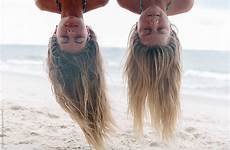 beach stocksy girls forbes raymond upside down