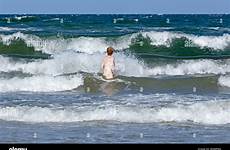skinny dipping beach stock alamy waves mecklenburg wustrow wind west woman