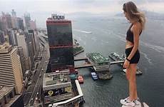 russian model rooftop hong top selfies tallest kong china edge structures poses building angela looking shun tak central centre nikolau