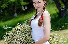 farm woman beautiful young summer girl collecting grass dry stock