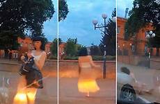 drunk woman russian caught swaying circles dashcam staggering way comments her eventually falling headlights shops