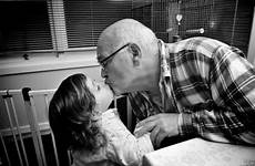 granddaughter grandfather kissing