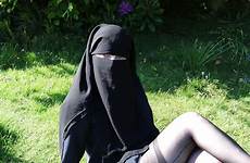 burqa flashing outdoors