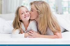 daughter mother kissing bed cheek her stock preview abode indoors