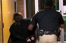 superintendent arrest handcuffs charged staff