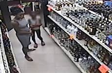 caught camera woman child store shoplift teaching steal shoplifting video liquor florida