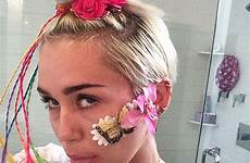 miley cyrus her instagram tongue daisy dukes selfie she bathroom strips just topless mouth look down speak rugged imagery toned