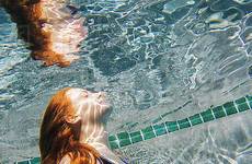 swimming underwater girl pool teenage hair red stock dissolve d145