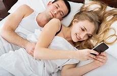 while cheating bed husband sleeping spouse affair signs having laying texting phone cell