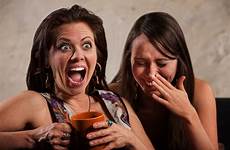 laughing friends friend woman holding screaming coffee mug next pain