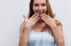 surprised redhead girl amazed covering shock surprise shocked screaming mouth hands woman young beautiful blue her preview