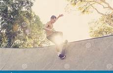 naked radical tricks torso practicing stunts jumping enjoying skate pipe concrete half young american man board