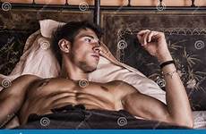 bed male shirtless model lying his alone sexy bedroom stock pillow looking dreamstime seductive preview appealing