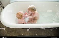 bath sister bathing baby siblings stock washing together alamy girl young bathtub