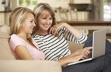 daughter mother teens parents teenage sofa teen manipulative teach parent laptop internet college sitting using being mom moms stock florida