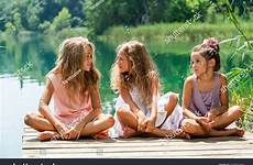threesome conversation having portrait female young jetty river shutterstock stock