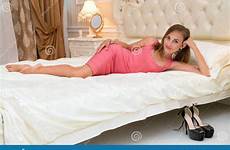 petite young bed laying female attractive looking stock dress beautiful preview
