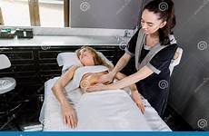 massage therapist female woman beautiful belly young pretty cosmetology medical having modern center women abdomen