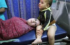 gaza israel hamas child slide mother palestinian hospital amid invade airstrikes dares leader boy