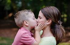 boy kiss young son mother mouth cute his giving