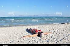beach sunbathing spain woman mallorca adult europe alcudia alamy mid stock mediterranean young shopping cart lying photography
