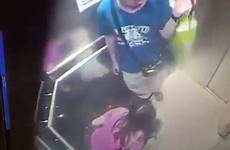 woman urinating caught camera while she floor urinates lift urinate kong between shocking security down there hong has her people
