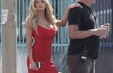 charlotte mckinney dress red her escorts blonde tiny mini she movie hand flaunts set short posed girlfriend decides when his