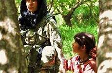 soldier girl american female young afghani afghan afghanistan helped being holds hands army village forces admiration visited awe looks