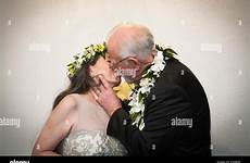 kissing older young man woman bride groom alamy stock wedding outdoors