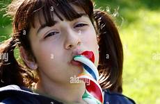 licking lollipop girl teenage alamy shopping cart