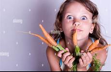 eating carrots young girl alamy fresh child sweet