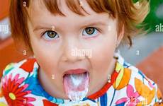 licking girl little cute ice cream alamy outside portrait happy
