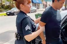 cop handcuffs handcuffed policewoman officers escorted arrested