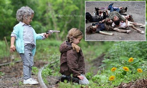 It may not display this or other websites correctly. Kids holding guns to each others heads and a pile of 'dead ...