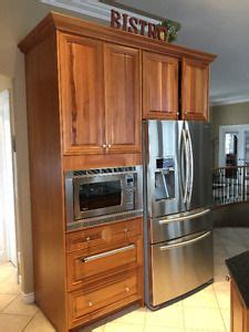 Maybe you would like to learn more about one of these? Cherry wood kitchen cabinets with granite countertops Red ...