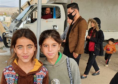 Young Yazidi Girls Receive Coats this Christmas - Mosaic Middle East