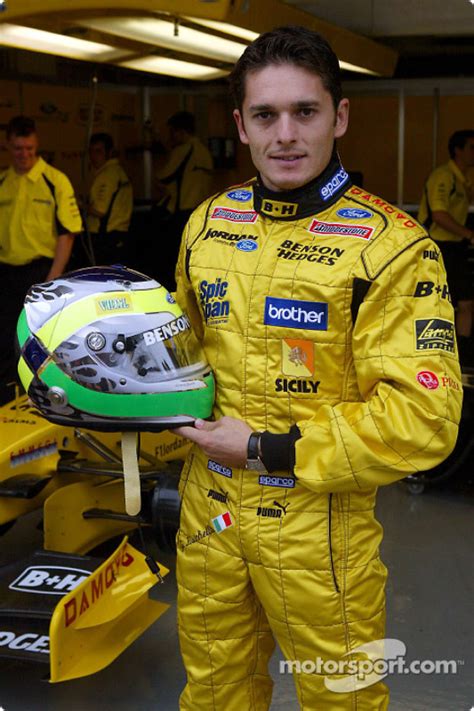 Professional tennis player from brazil management: Giancarlo Fisichella shows his new helmet at Japanese GP