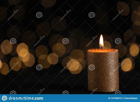 Available now on itunes, music stores and record. Burning Gold Candle Against Blurred Lights In Darkness ...