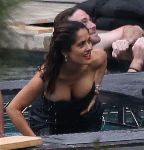 He deserves a kiss after giving her a. Salma Hayek almost spills out of her dress during sexy ...