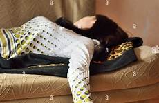 drunk sleeping woman sofa alamy