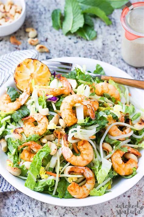 This thai shrimp salad packs tons of flavor with fresh herbs and an almond butter thai salad dressing. Healthy Grilled Asian Thai Shrimp Salad Recipe | Wicked Spatula