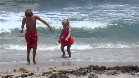 Kids build sandcastles on the beach. the allies landed on the beach at normandy during the second world war. Kids playing at the beach 7-7-12 - YouTube