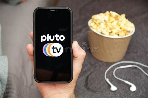 If you don't get a prompt about your free year automatically, tap or click on a new apple original show. Pluto TV Logo On The Tablet Screen Laying On The White ...