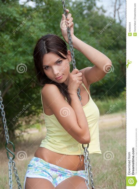 Real amateur teen first casting. Lady Having Fun On The Swings At The Park Stock Photo ...