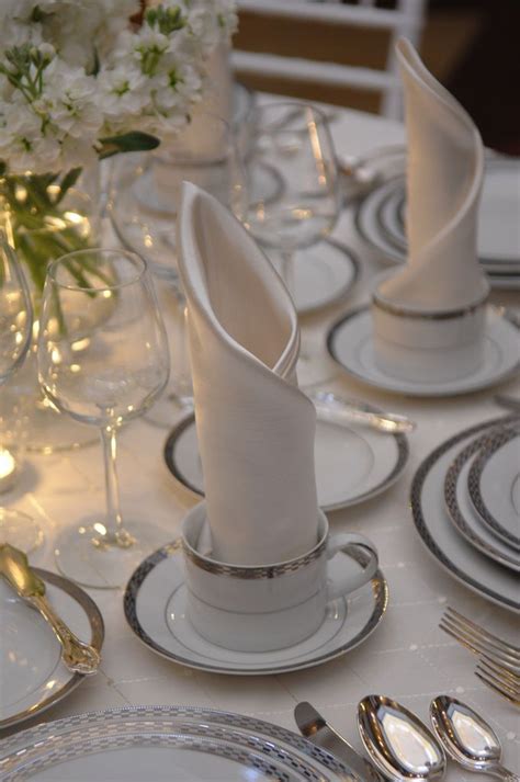 Tables adorned with a tablecloth and place cards napkins and neatly arranged thanksgiving table setting inspiration. An elegant Place Setting (for seated multi-course dinner ...