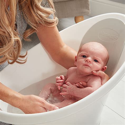 This baby bathtub can convert from an infant tub to a toddler tub. Shnuggle Baby Bath with Foam Backrest and Bum Bump Support ...